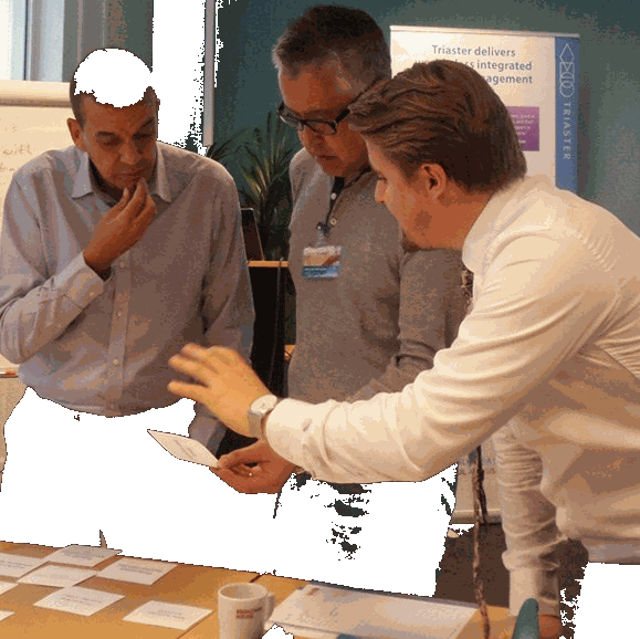 Team reviewing a process library on screen before launch