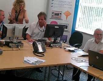 Colleagues discussing a process map during a mapping workshop session